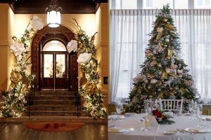 Luxury hotel entrance and dining room decorated with elegant Christmas trees and gold ornaments