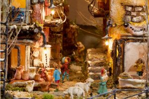 Traditional handcrafted nativity scene in Naples with detailed figurines and village houses