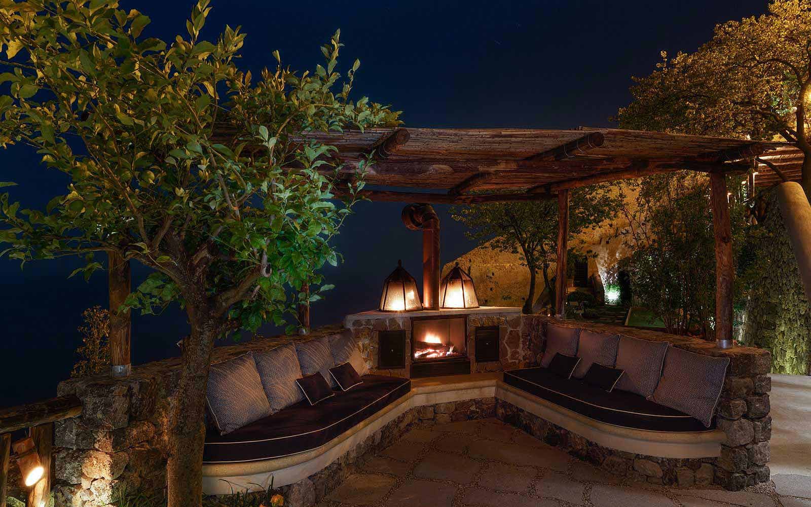 Outdoor fireplace at Monastero Santa Rosa