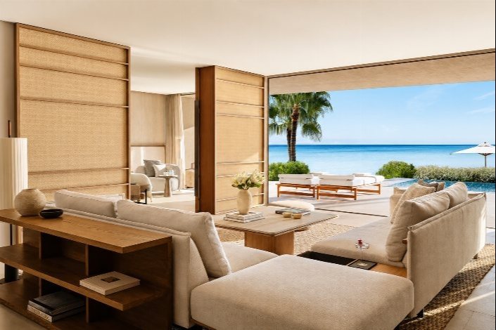 Luxury beachfront residence with open-plan living room, private pool and ocean views.